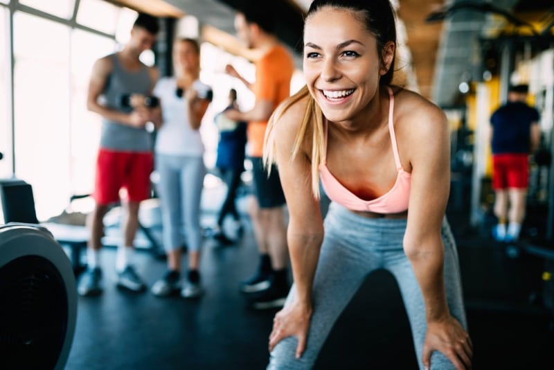 Maui Gyms: A young woman smiles as she takes a breathe between exercises at a local gym in West Maui.