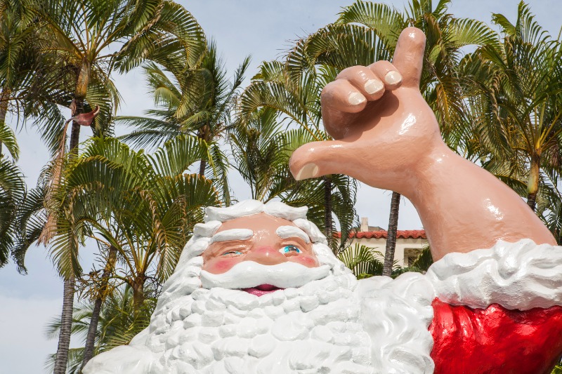 Christmas in Hawaii: A large Santa statue smiling while showing the "hang-loose" hand gesture.