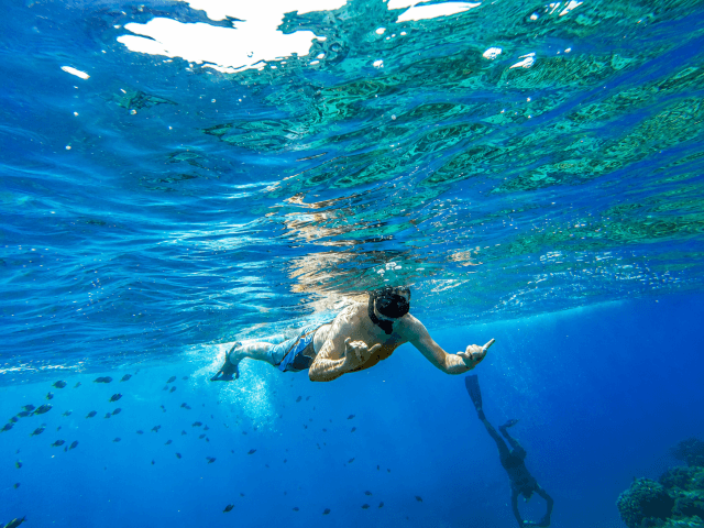 A man exploring one of the best snorkeling spots on O‘ahu